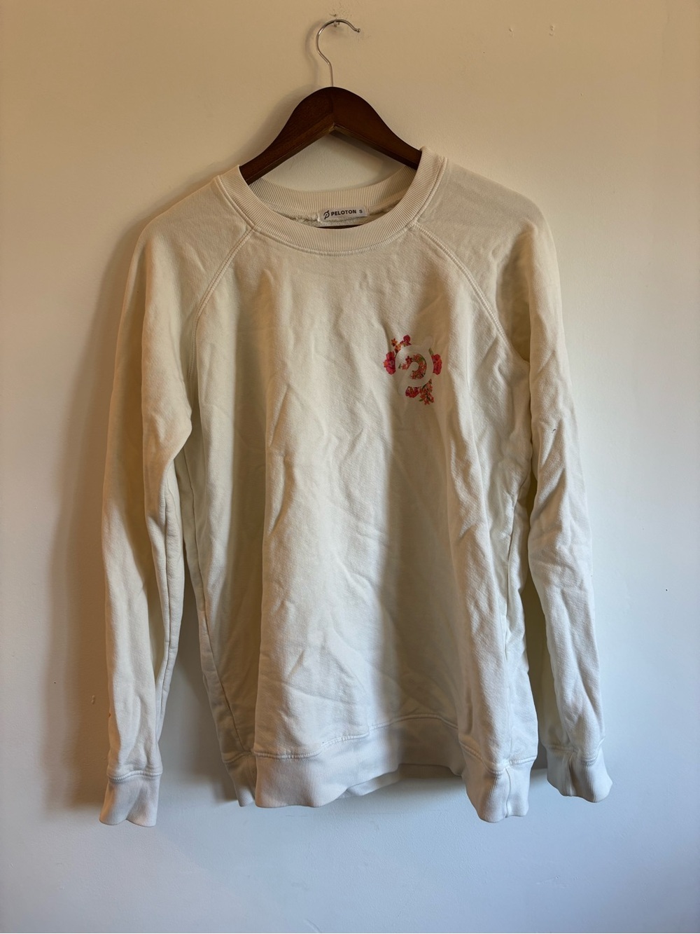 Peloton Cream Pullover Sweatshirt with Pink Floral Logo